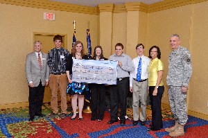 In June, chapter members and scholarship winners celebrating are (l-r) Gen. Rayburn, Matthew Kloenne, Jessica Randell, Jordan Eisel, Mark Clagett, David Wise, Col. Joyce Jenkins-Harden, USAF (Ret.), chapter vice president for education; and Col. Curry.
